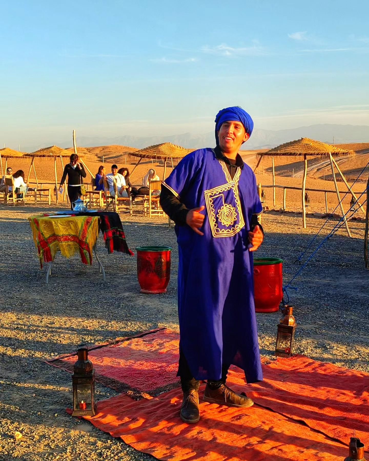 A local host at a desert camp