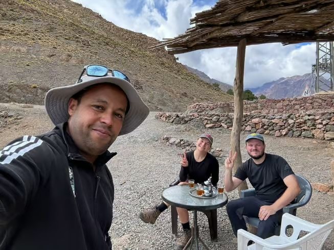 Travellers resting at a simple mountain café