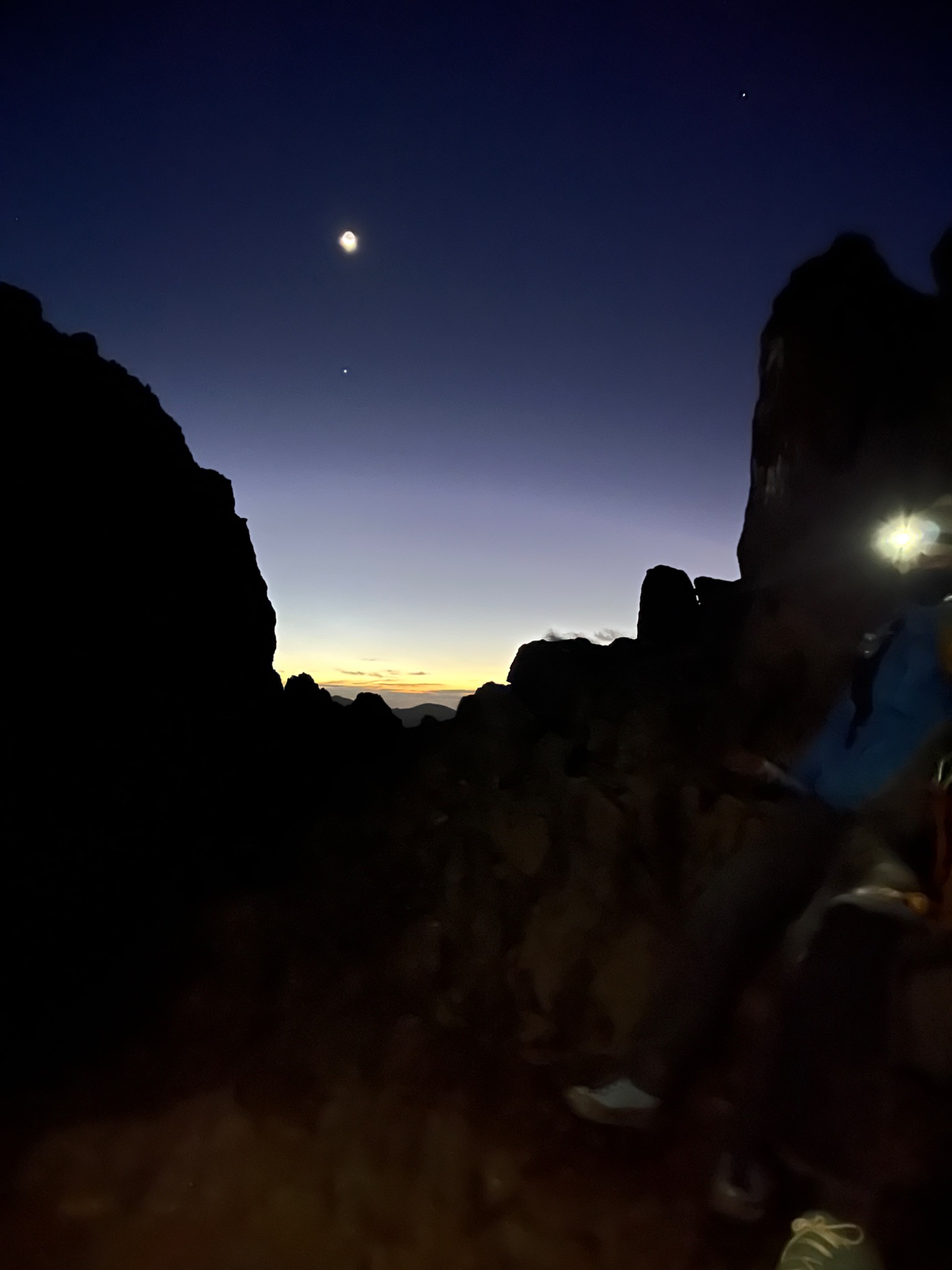 Dark mountain silhouettes at dusk