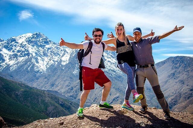 A group of hikers on a snowy High Atlas summit