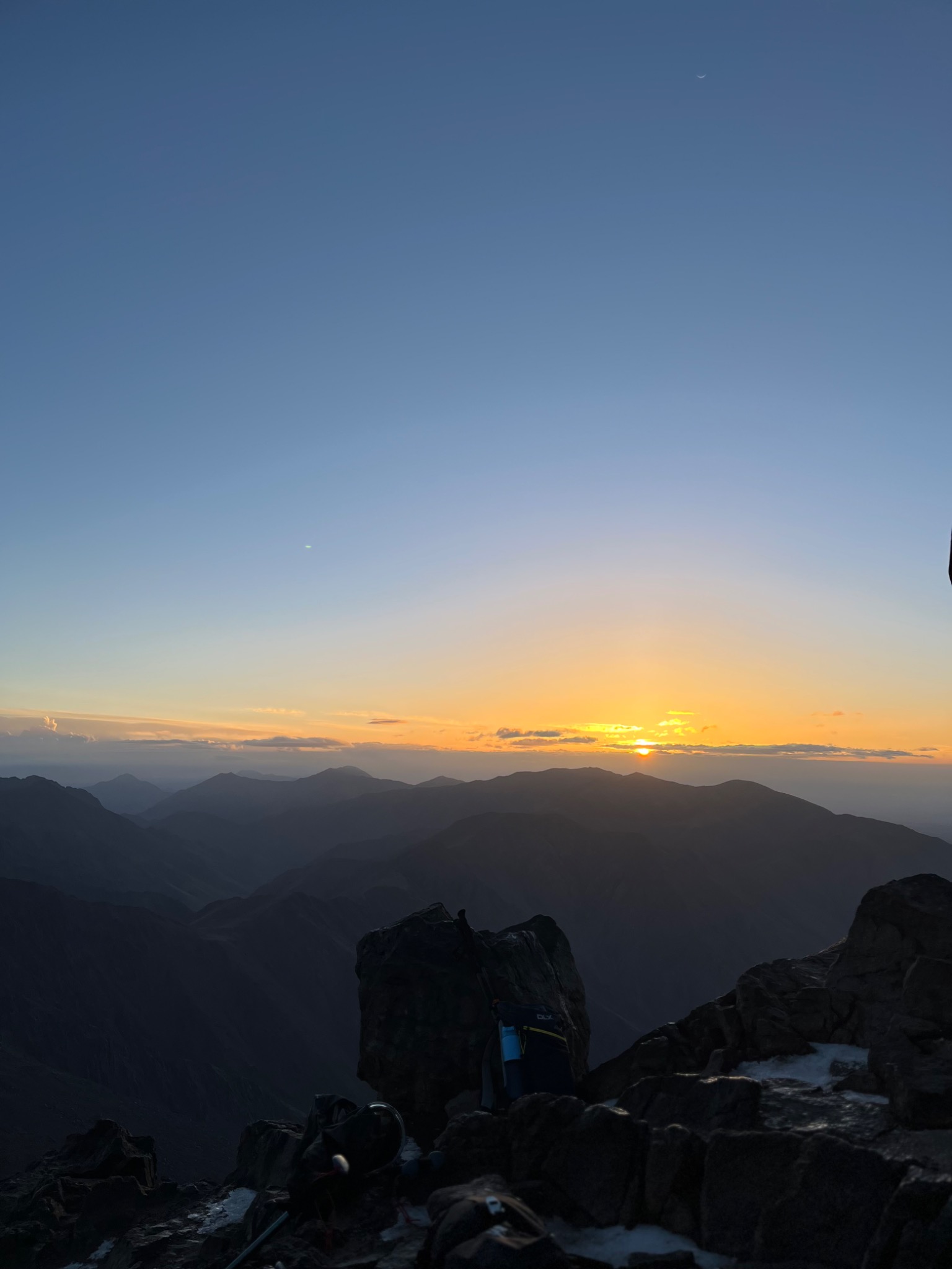 Sunrise over layers of mountain peaks